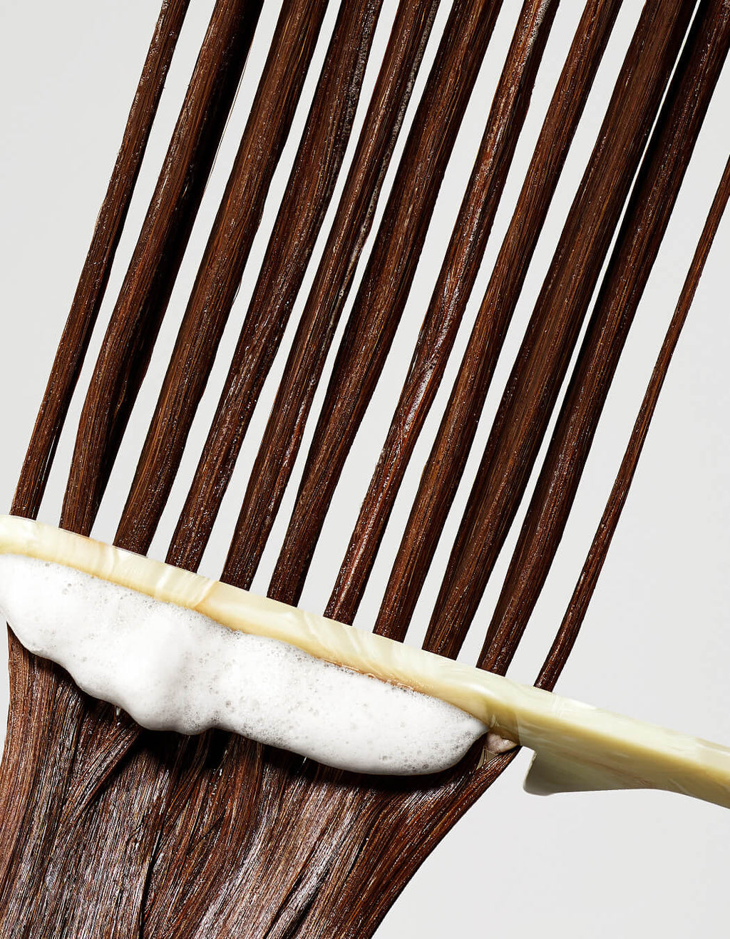 RevitaLash Thickening Conditioner combed through hair