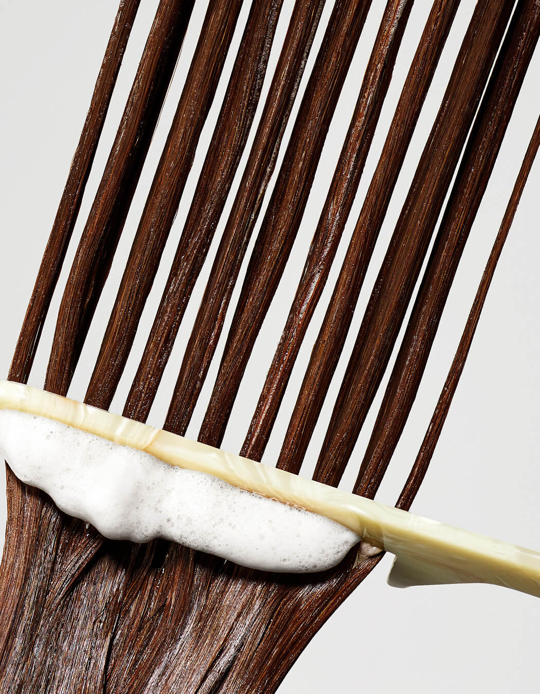 RevitaLash Thickening Conditioner combed through hair